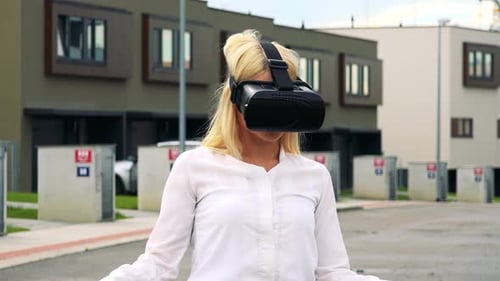 Woman Experiencing Virtual Reality in a Suburban Setting