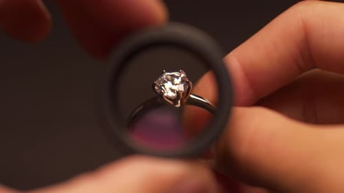 Diamond Ring Examined Under Jeweler's Loop