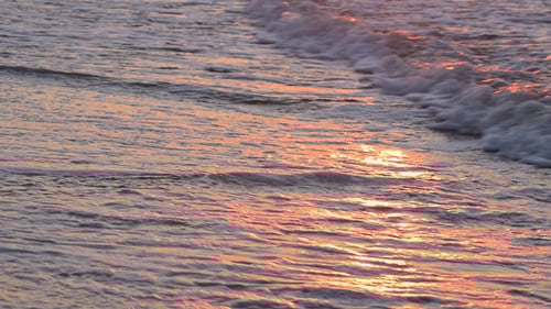 Sea Waves and Sunny Reflections