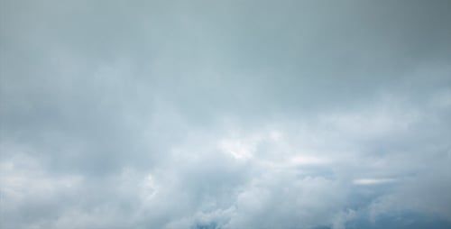 Clouds Moving Gently Across the Light Blue Sky