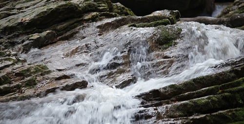 Cascading Waterfall Flowing over Rocks in Nature