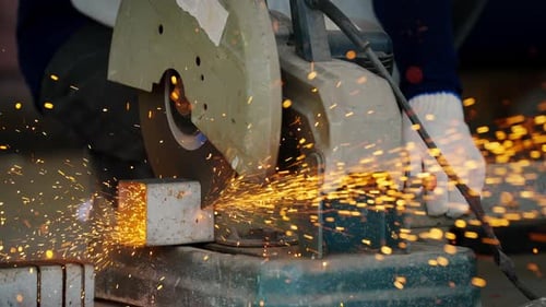 4K Asian man worker working on electric angle grinding machine cutting steel bar