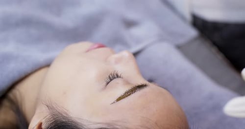 Close up of cosmetologist making microblading procedure