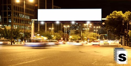 City Highway Traffic at Night with Billboard
