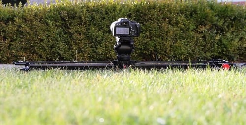 Camera on Dolly on Green Grass Lawn
