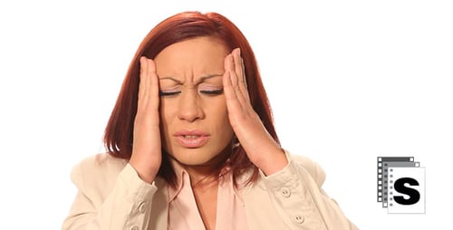 Woman Experiencing Headache Against White Background