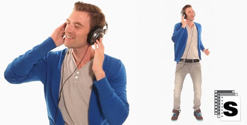 Man Dancing to Music with Headphones in Studio