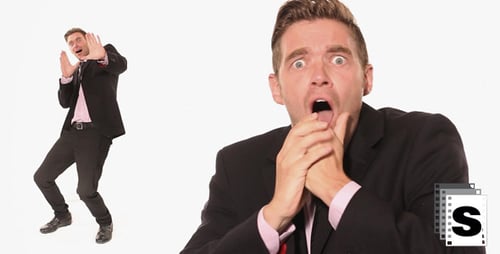 Man in Suit Reacts in Fear and Horror