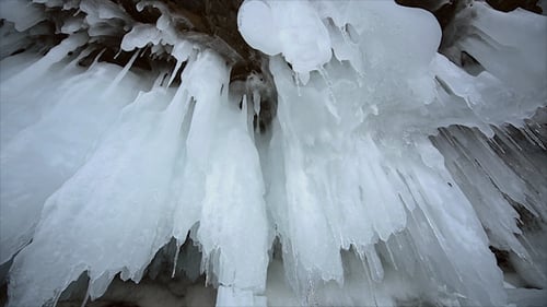 Icy Cave Formations in Frozen Landscape