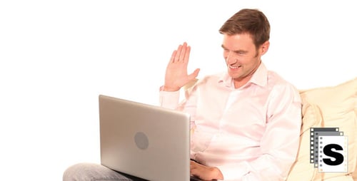 Man Using Laptop Computer on Couch