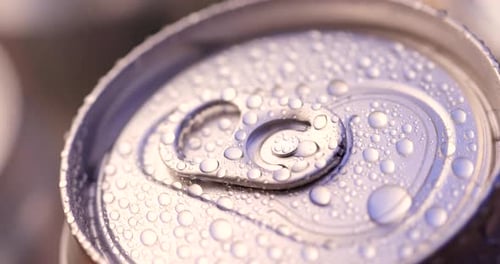 Chilled Silver Soda Can with Water Droplets