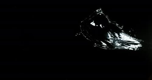 Water Splashes in Slow Motion Against Black