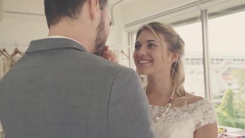 Bride Smiles at Groom on Wedding Day