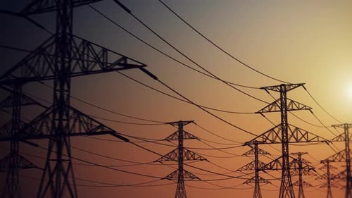 Panning Shot of Electricity Pylons at Sunset