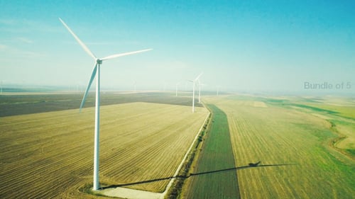 Wind Turbines Turning in Green Rural Landscape Aerial