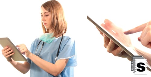 Woman Doctor in Scrubs Using Tablet