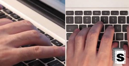 Typing on Laptop in Corporate Office Environment