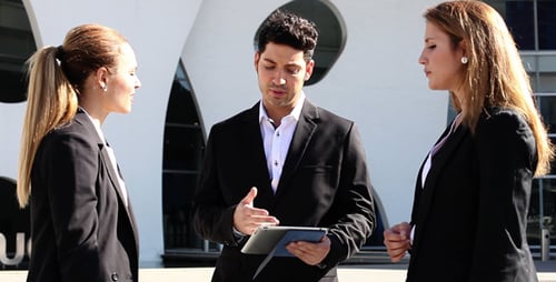 Business Team Meeting Outside Modern Building