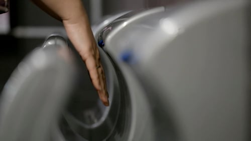 Hand Drying with Modern Public Restroom Hand Dryer