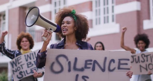 Young Woman Leads Protest with Megaphone