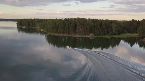 Speedboat Cruising on a Tranquil River