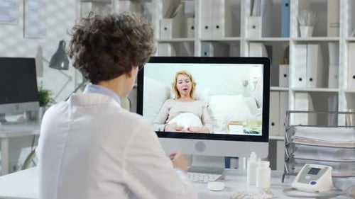Doctor Speaking to Patient on Video Call