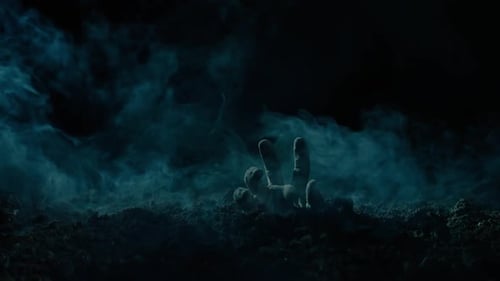 Hand Emerging from Dark Soil with Fog