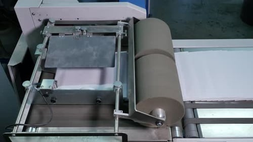 Industrial process of making envelopes in a factory