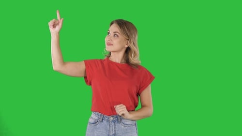 Smiling Woman Pointing on Green Screen Background