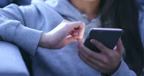 Close up of woman using mobile phone