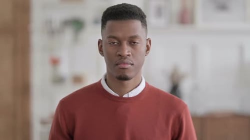 Young Adult Stares Directly at Camera Close Up