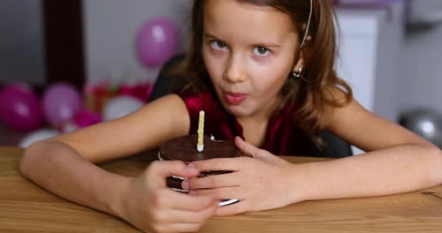 Girl Celebrates Birthday with Chocolate Cake