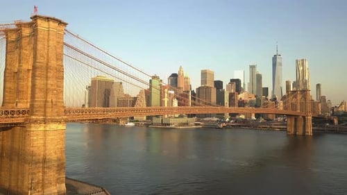 AERIAL: Flight Towards Brooklyn Bridge with Manhattan and East River View at Sunrise, Sunset