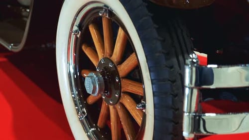 Antique Car Wheel with Wood Spokes and Whitewall Tires