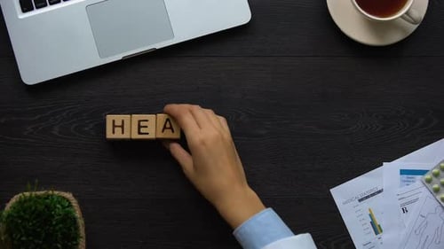 Healthcare Spelled Out with Blocks on Desk