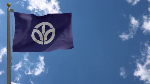 Realistic Waving Flag with Abstract Plant Symbol Against Blue Sky