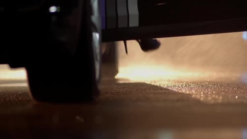 Woman Exits Car in High Heels at Night