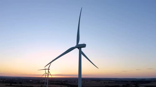 Aerial, drone. energy producing wind turbines. wind energy farm generating electricity.