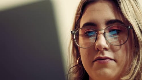 Woman Reading Off a Computer Screen Close Up