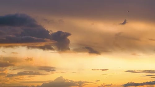 Stormy Clouds Move Smoothly in the Red Sky at Sunset. Timelapse. Cloud Space.