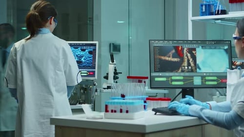 Scientists Conducting Experiment in Modern Laboratory