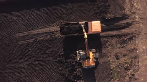Top Down View of Construction Site with Machinery, Truck, Excavator