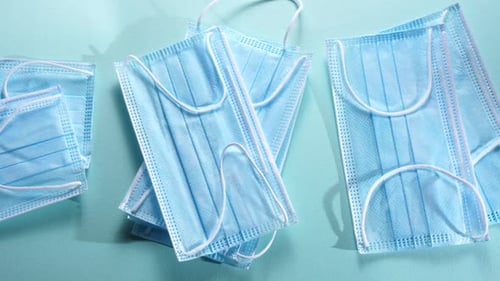 Close Up of Several Blue Surgical Face Masks