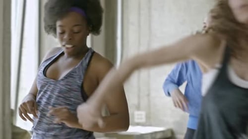Women Dancing Together in a Fitness Class