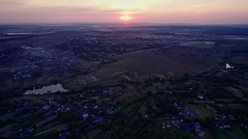 Village Hills and Fields During Evening Sunset