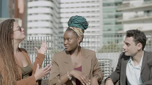 Front View of Excited Diverse Business Partners Talking Outdoor