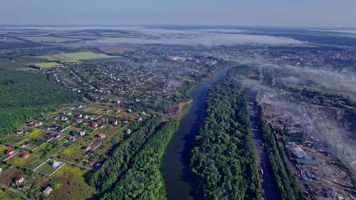 Small Village Covered in Mist in the Morning Sun
