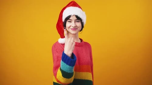 Woman Celebrates Christmas with Confetti in Studio