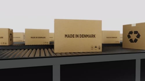 Boxes with MADE IN Denmark Text on Conveyor