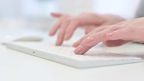 Close Up of Woman Hands Typing on Keyboard